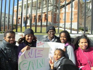 (from left) MissionSAFE members Keturah Blanco, Ronaja Tarrant-King, E.J. Slater, Yvonne Skinner, Zaire Richardson and Kashara Egleston join in a Youth Jobs Coalition rally outside the State House on Feb. 21. About 1,200 youths from various organizations, including the local Mission Hill Youth Collaborative and Sociedad Latina, demanded state funding for youth jobs and more opportunities from big businesses. (Courtesy Photo)