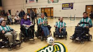 Members of the Boston Brakers power wheelchair soccer team show off their second-place trophy at a March 21 tournament held at the University of Vermont. The team, based at the Tobin Community Center, went 2-1 in the tourney before falling to the Massachusetts Hospital School Chariots, 8-0. For more info, see bostonbrakers.com. (Courtesy Photo)