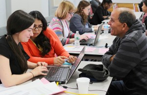 U.S. citizenship applicant Juan Guerrero (right) shares a laugh with ABCD staff members during the April 23 Citizenship Day event at ABCD’s Parker Hill/Fenway Neighborhood Service Center on Parker Street. The event helps people apply for citizenship in a variety of ways. (Courtesy Photo)